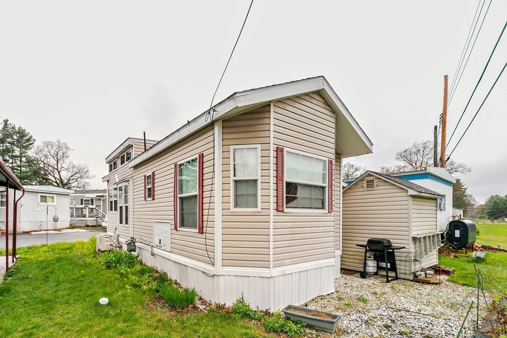 404 Southwick Road, Unit 9 Westfield, MA 01085 - Photo 27 of 30 a front view of a house with a yard