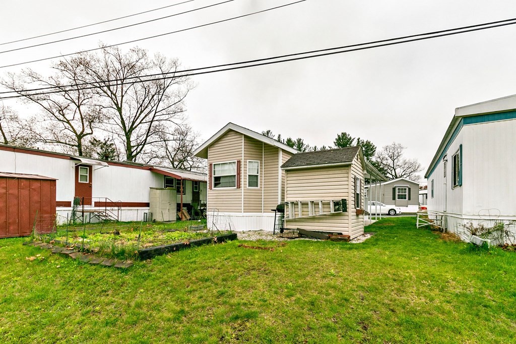 404 Southwick Road, Unit 9 Westfield, MA 01085 - Photo 28 of 30 a view of a house with a yard
