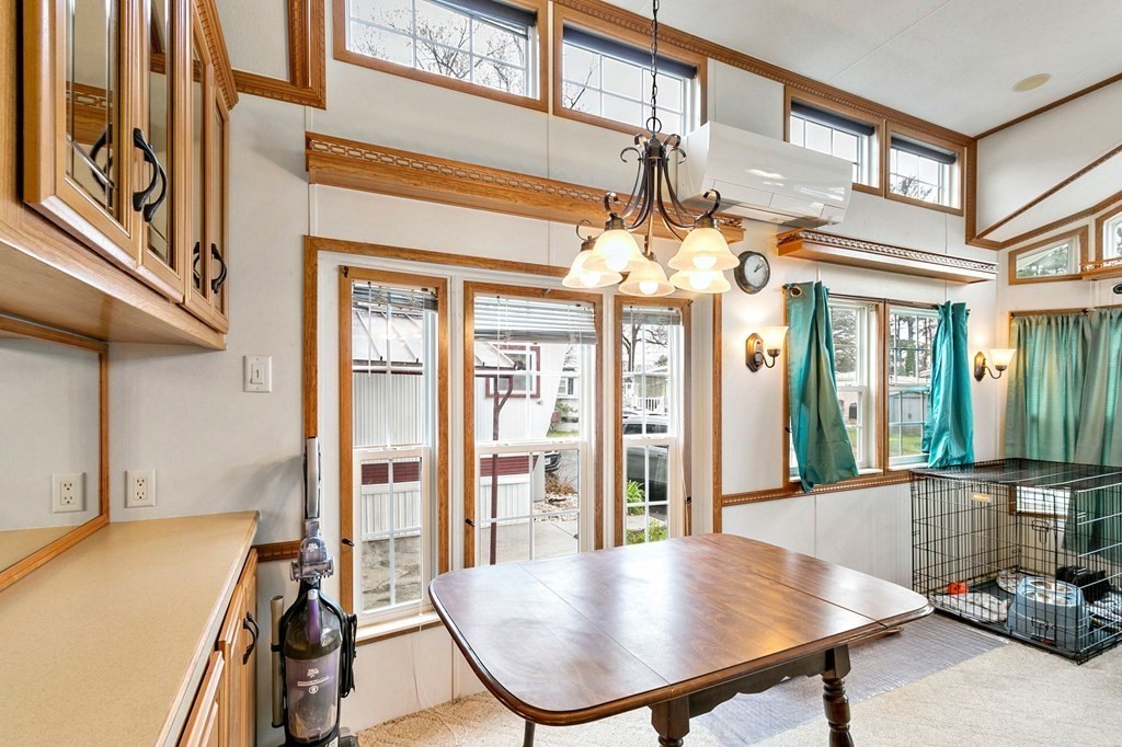404 Southwick Road, Unit 9 Westfield, MA 01085 - Photo 8 of 30 a view of a living room and chandelier