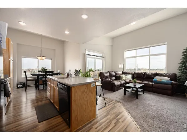 a living room with lots of furniture and a window