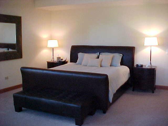 368 South Davis Street, Unit A7 Telluride, CO 81435 - Photo 2 of 9 a bedroom with a bed and a lamp