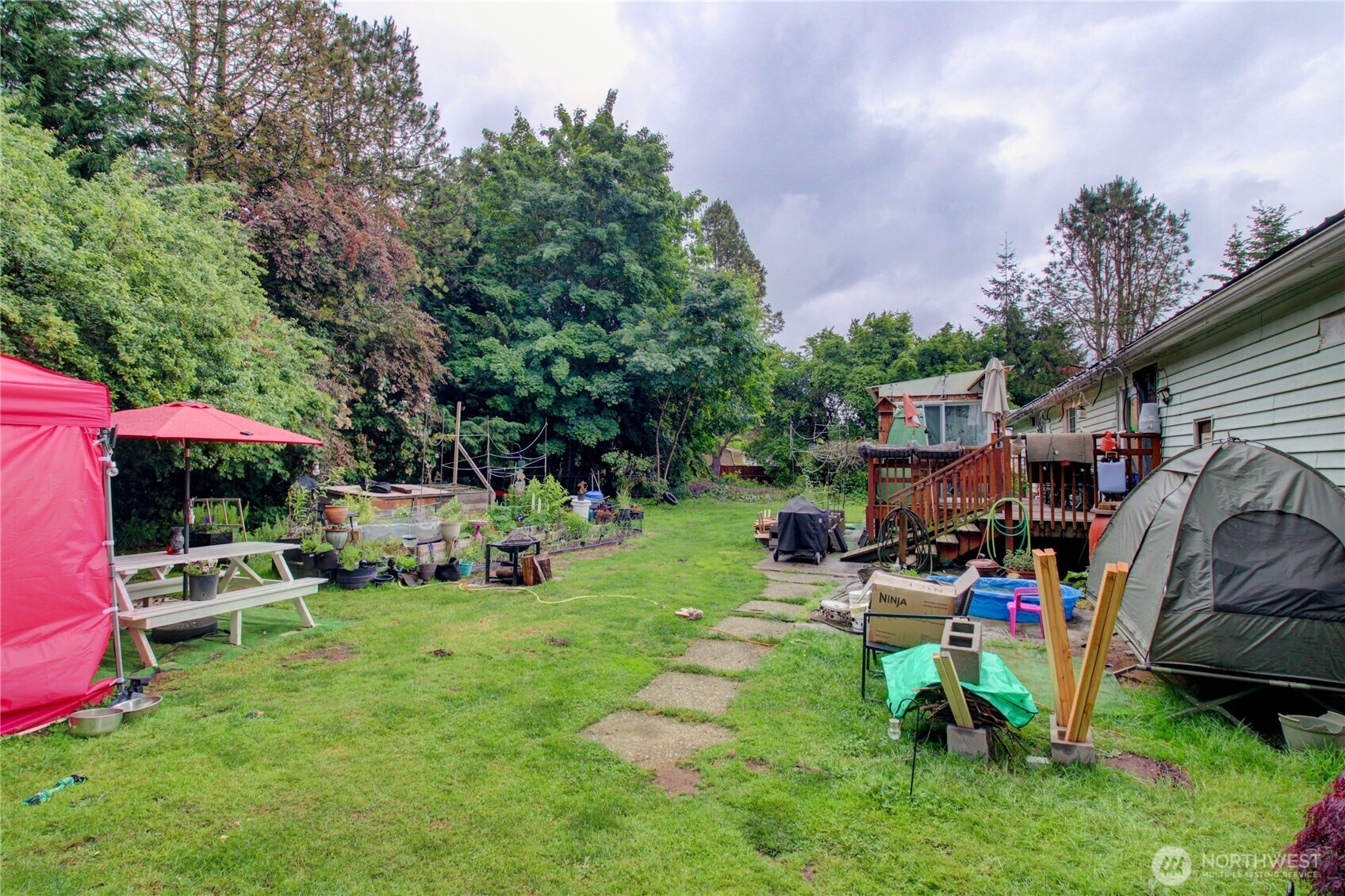 7185 Old Highway 99 North Road Burlington, WA 98233 - Photo 9 of 26 a view of a backyard with sitting area and slide