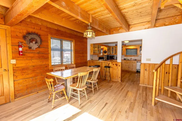 a kitchen with stainless steel appliances a stove and a sink