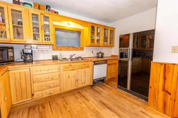 a kitchen with stainless steel appliances granite countertop a stove and a sink