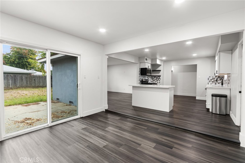 2618 Hoover Court Merced, CA 95340 - Photo 11 of 30 a kitchen with granite countertop a stove and a refrigerator