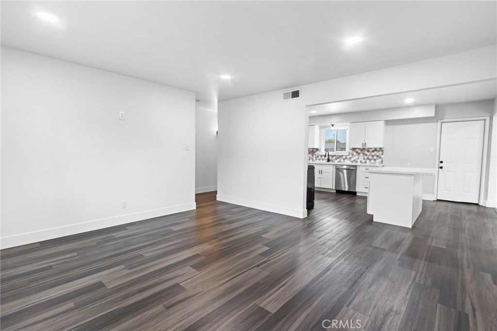 2618 Hoover Court Merced, CA 95340 - Photo 13 of 30 a view of a kitchen with wooden floor and a refrigerator