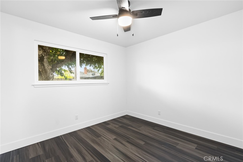 2618 Hoover Court Merced, CA 95340 - Photo 19 of 30 an empty room with wooden floor and windows