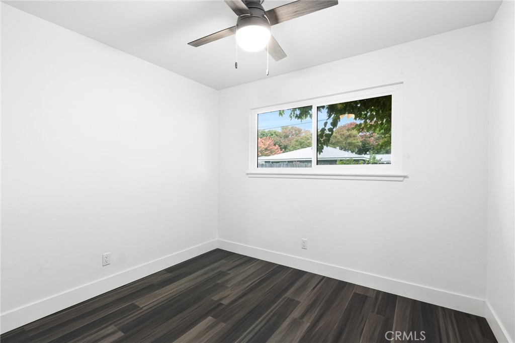 2618 Hoover Court Merced, CA 95340 - Photo 21 of 30 an empty room with a window and ceiling fan