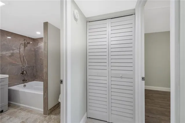 a bathroom with a bathtub and a shower