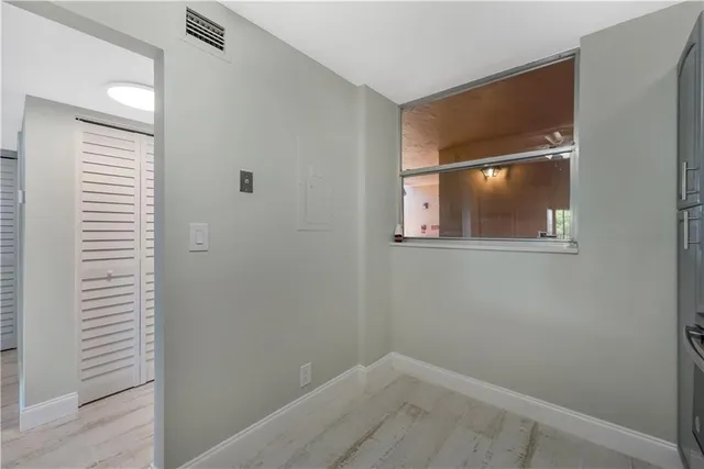 a view of a room that has a window