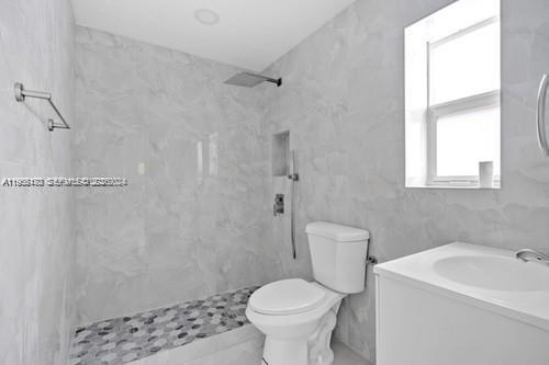 655 Southwest 5th Street Homestead, FL 33030 - Photo 16 of 23 a bathroom with a sink toilet and shower