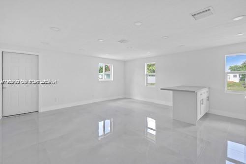 655 Southwest 5th Street Homestead, FL 33030 - Photo 4 of 23 an empty room with windows