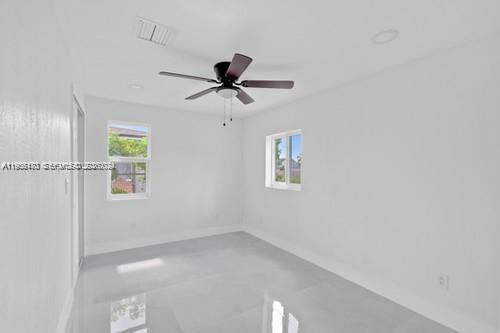 655 Southwest 5th Street Homestead, FL 33030 - Photo 8 of 23 a view of a livingroom with a window and a ceiling fan