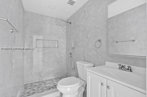 655 Southwest 5th Street Homestead, FL 33030 - Photo 10 of 23 a bathroom with a sink a toilet and shower