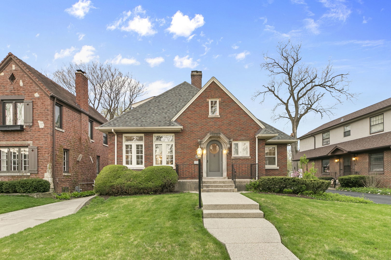 260 Bartram Road Riverside, IL 60546 - Photo 3 of 36 a front view of a house with a yard