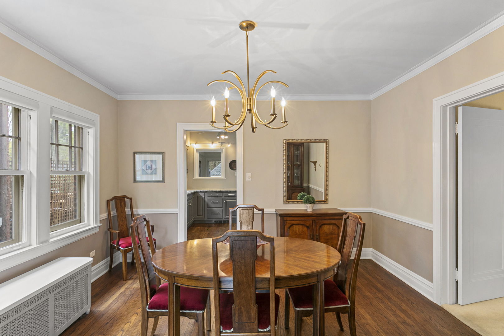 260 Bartram Road Riverside, IL 60546 - Photo 7 of 36 a view of a dining room with furniture and chandelier