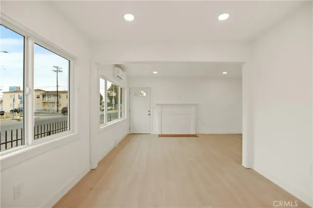 a view of white cabinets and a sink