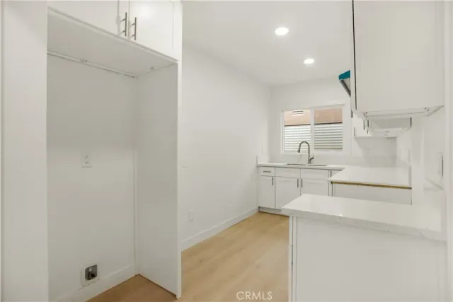 a kitchen with sink cabinets and window