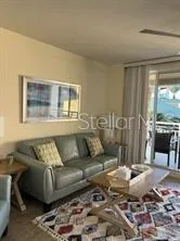 a bathroom with a granite countertop sink a toilet and a mirror