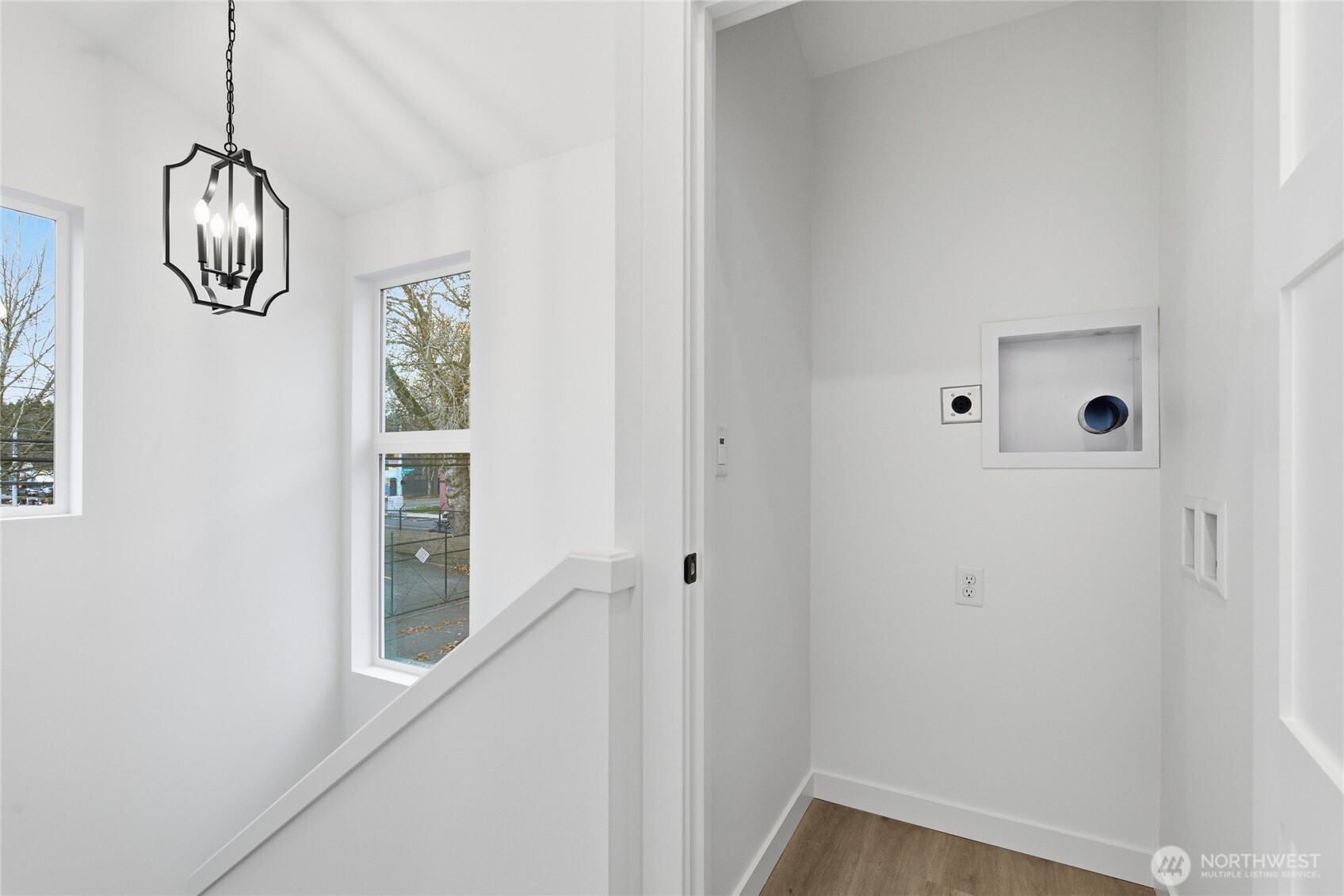 805 South Sullivan Street, Unit B Seattle, WA 98108 - Photo 15 of 20 a view of a hallway with wooden floor and a window
