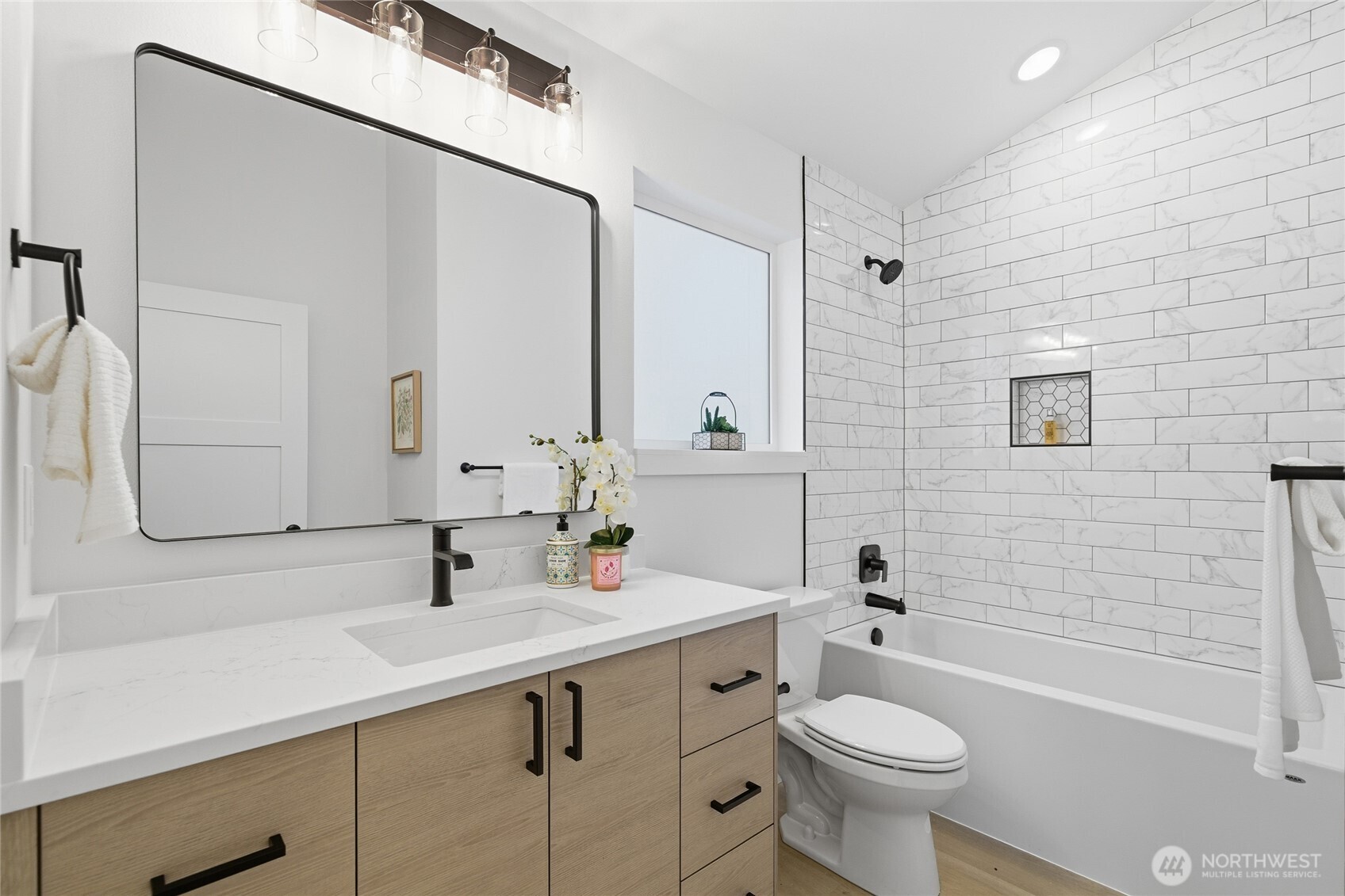 805 South Sullivan Street, Unit B Seattle, WA 98108 - Photo 19 of 20 a bathroom with a sink toilet tub and shower