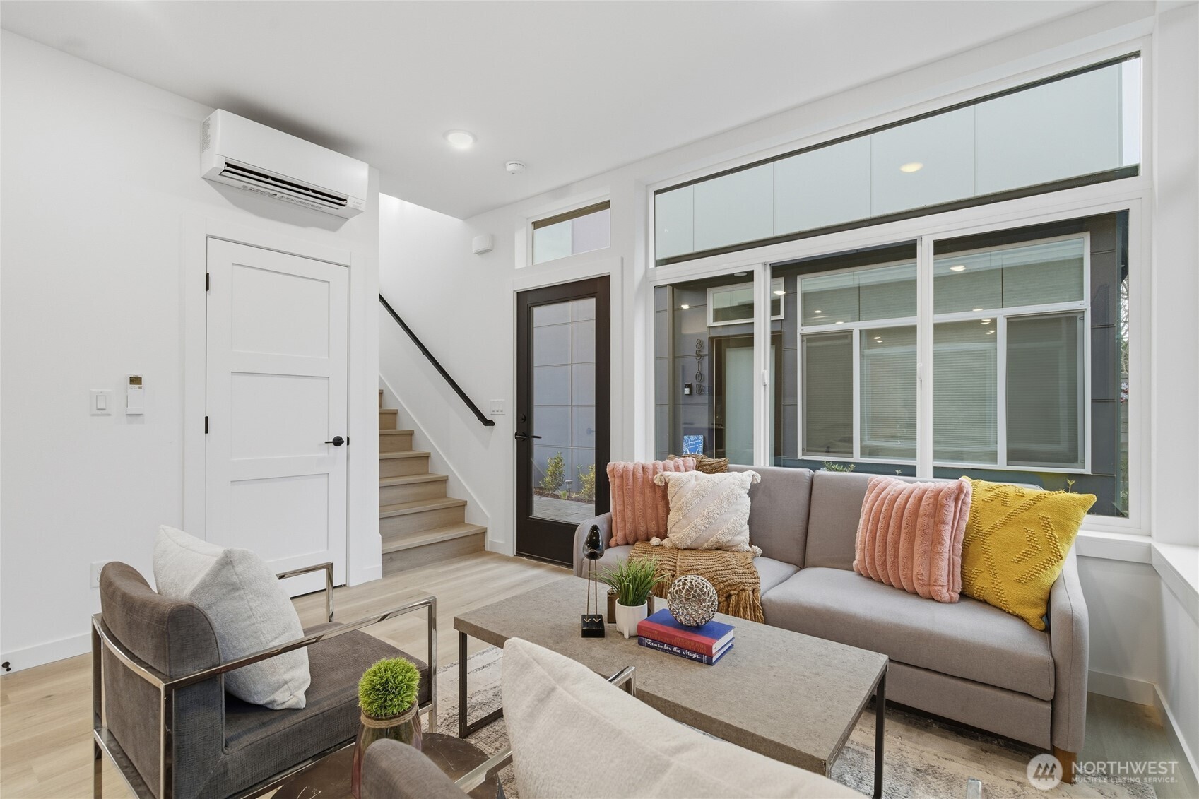 805 South Sullivan Street, Unit B Seattle, WA 98108 - Photo 4 of 20 a living room with furniture and a large window