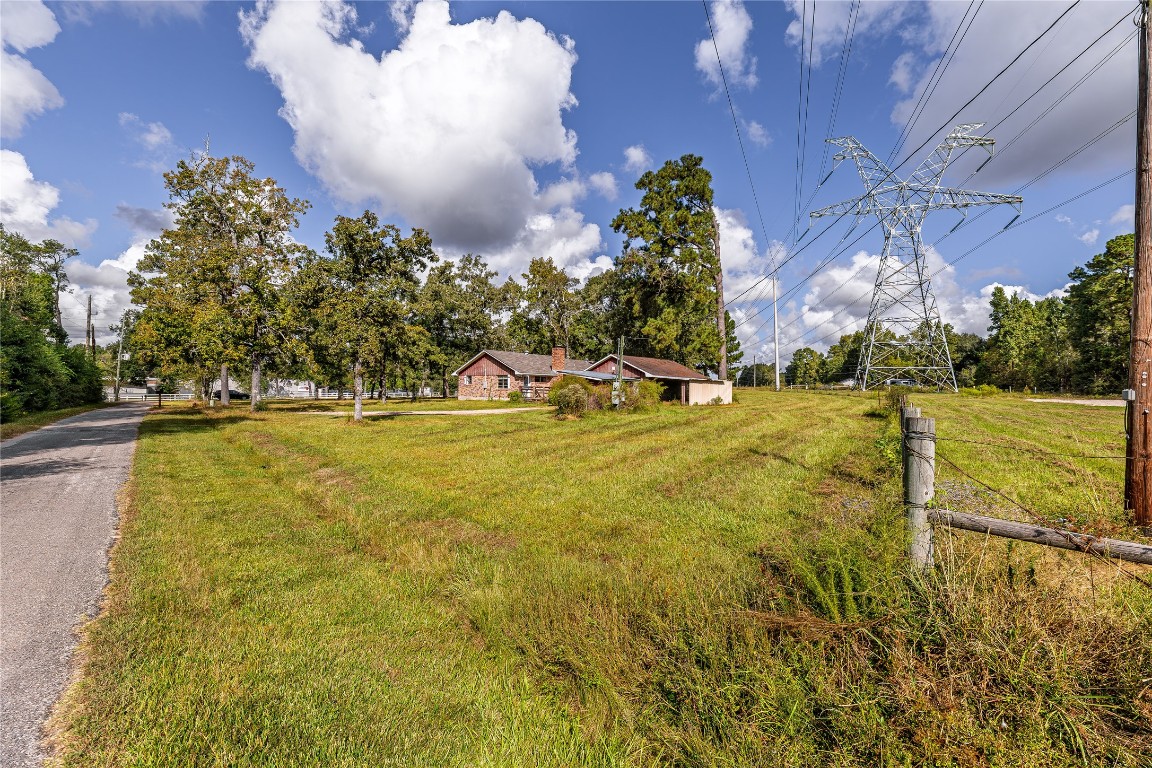 32302 Dobbin-Huffsmith Road Magnolia, TX 77354 - Photo 14 of 34 a view of a swimming pool with an outdoor space