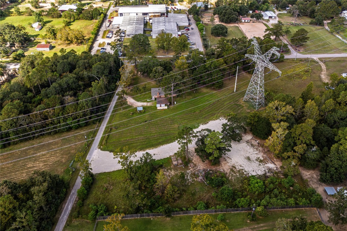 32302 Dobbin-Huffsmith Road Magnolia, TX 77354 - Photo 2 of 34 an aerial view of a residential houses with outdoor space and trees all around