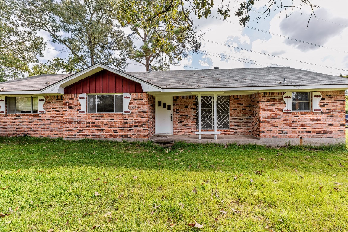 32302 Dobbin-Huffsmith Road Magnolia, TX 77354 - Photo 24 of 34 a front view of a house with a garden