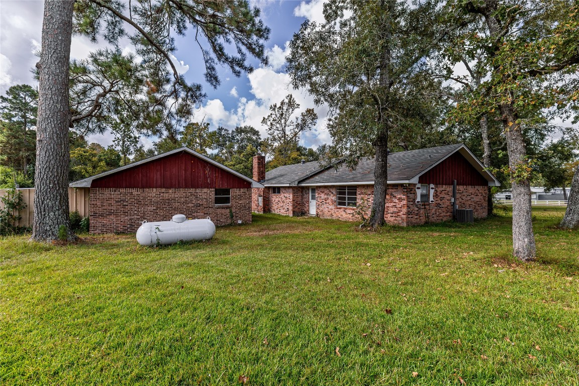 32302 Dobbin-Huffsmith Road Magnolia, TX 77354 - Photo 26 of 34 a wooden house with pool in front of it