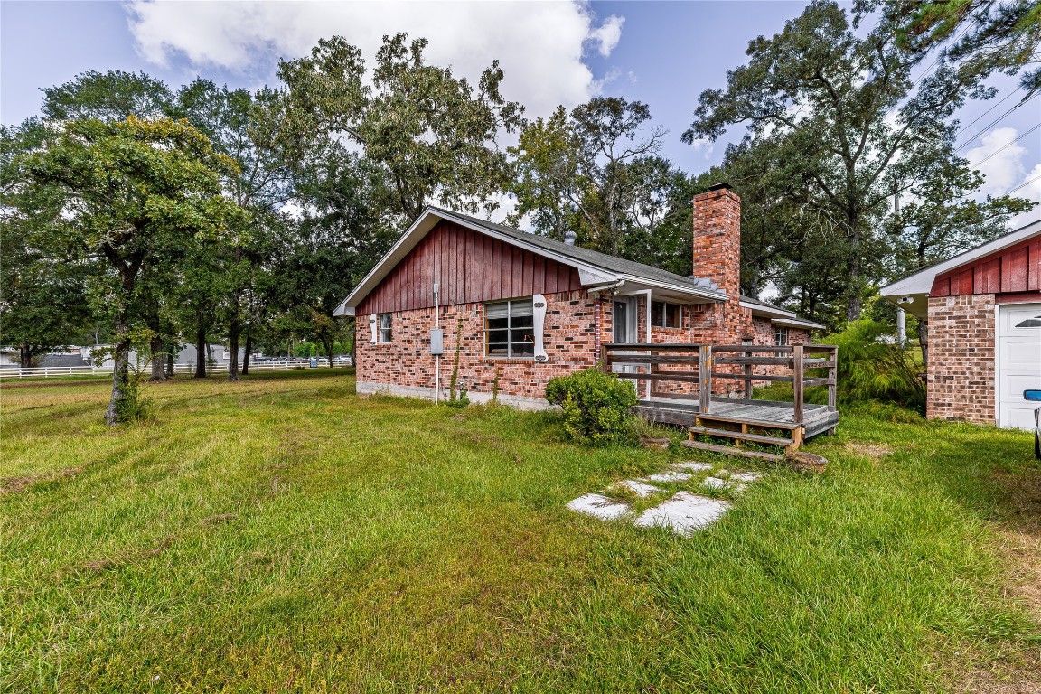 32302 Dobbin-Huffsmith Road Magnolia, TX 77354 - Photo 27 of 34 a view of a house with a big yard
