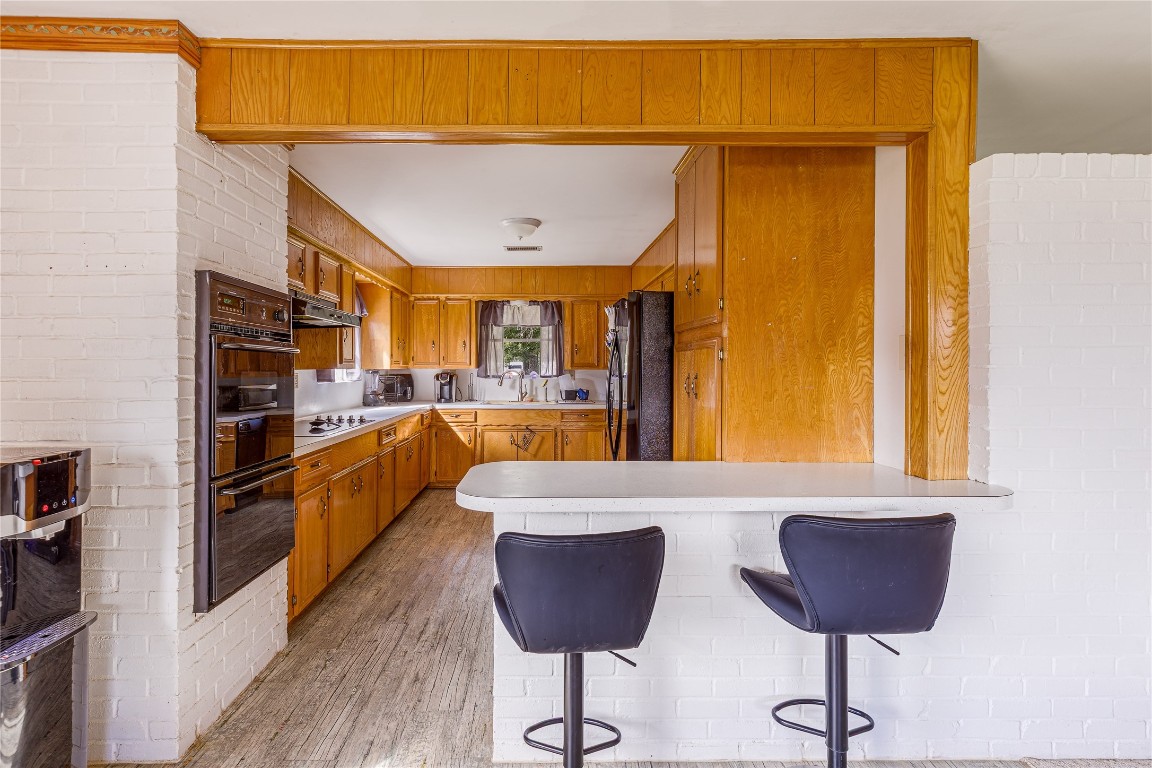 32302 Dobbin-Huffsmith Road Magnolia, TX 77354 - Photo 34 of 34 a view of kitchen and dining area with chandelier