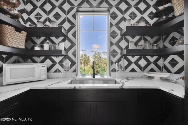 a view of a lake with houses in the back