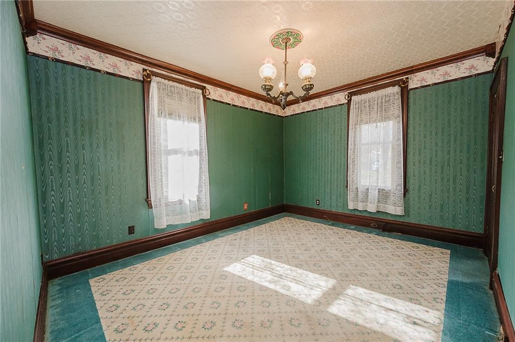 211 Old Mill Road Apollo, PA 15613 - Photo 16 of 42 a view of a big room with windows and chandelier