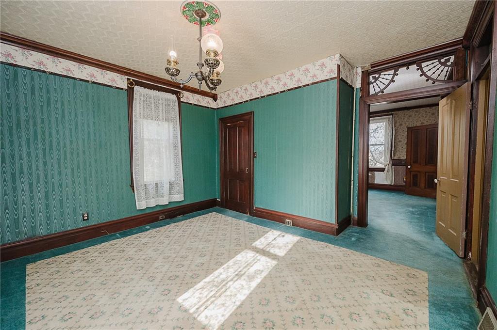 211 Old Mill Road Apollo, PA 15613 - Photo 17 of 42 a view of a hallway with a chandelier