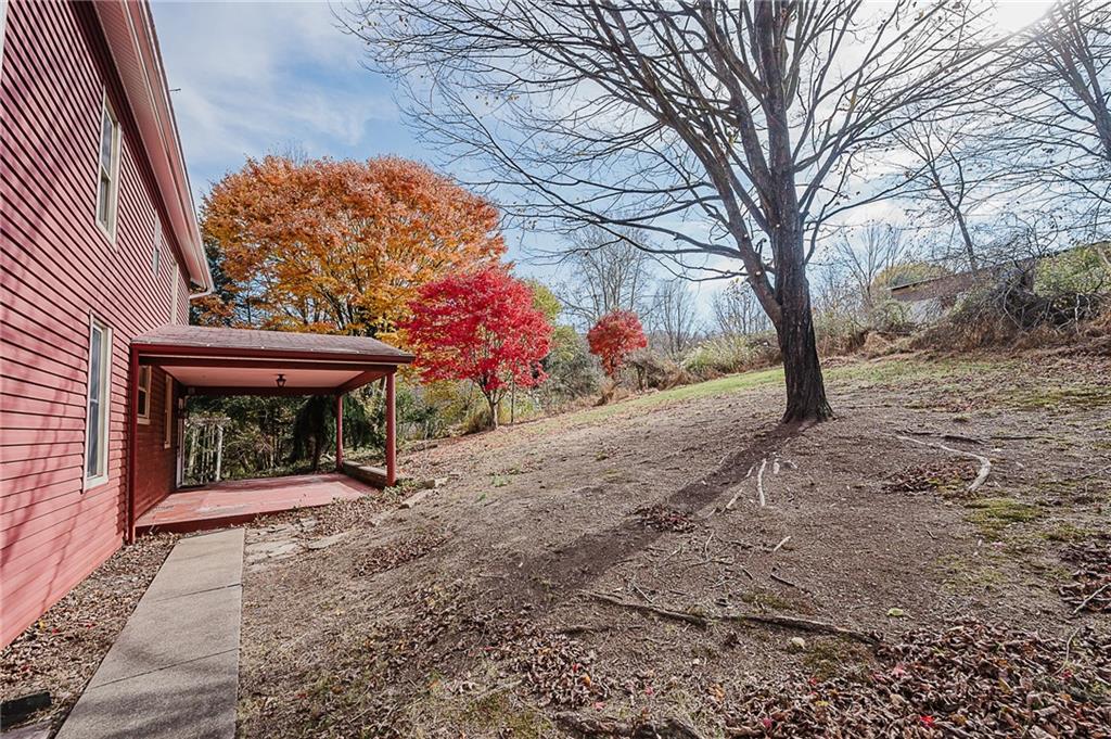 211 Old Mill Road Apollo, PA 15613 - Photo 36 of 42 a front view of a house with a yard and a garage