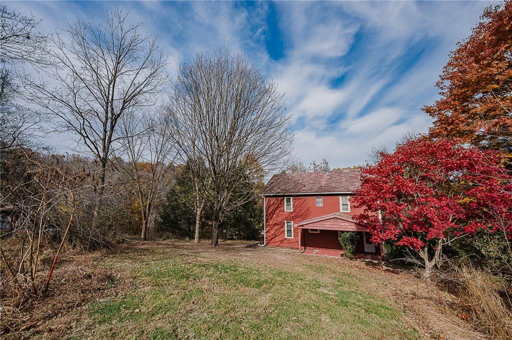 211 Old Mill Road Apollo, PA 15613 - Photo 40 of 42 a view of a house with a large tree and a forest
