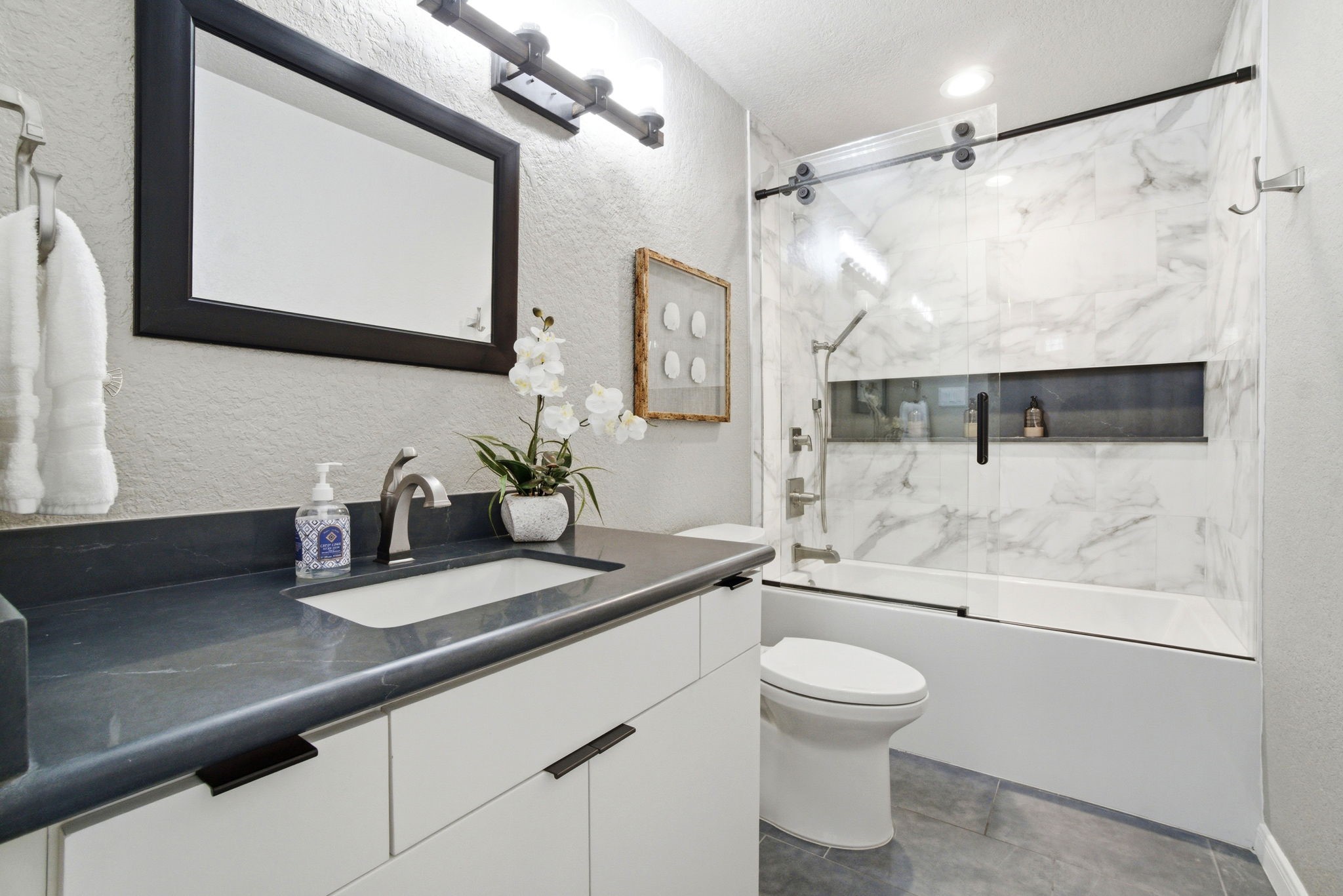 1609 Schooner Point Willis, TX 77318 - Photo 19 of 50 a bathroom with a sink a toilet and shower