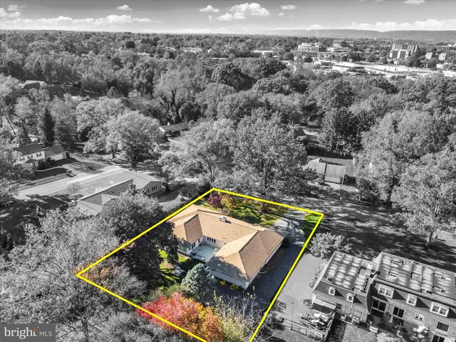 an aerial view of residential houses with outdoor space