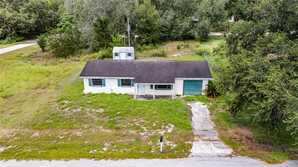 33099 Mulberry Road Dade City, FL 33523 - Photo 11 of 21 a aerial view of a house with garden