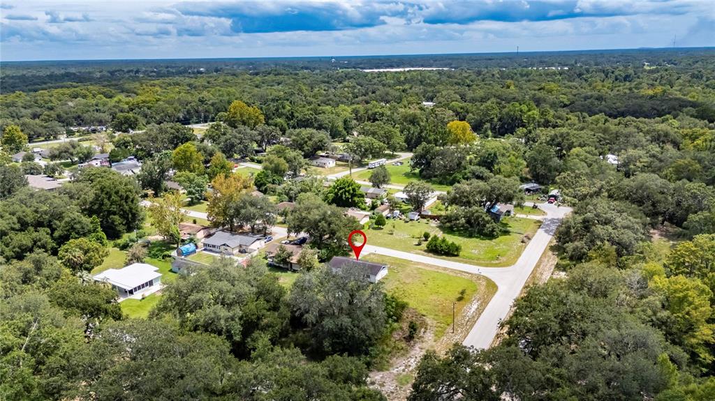 33099 Mulberry Road Dade City, FL 33523 - Photo 17 of 21 an aerial view of a house with a yard