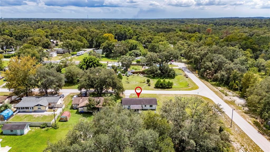 33099 Mulberry Road Dade City, FL 33523 - Photo 19 of 21 a view of a house with a yard and lake view