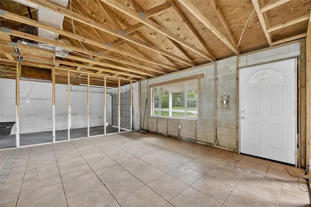 a view of an empty room with windows