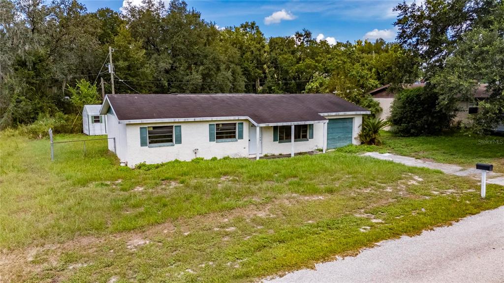 33099 Mulberry Road Dade City, FL 33523 - Photo 7 of 21 a house view with a garden space