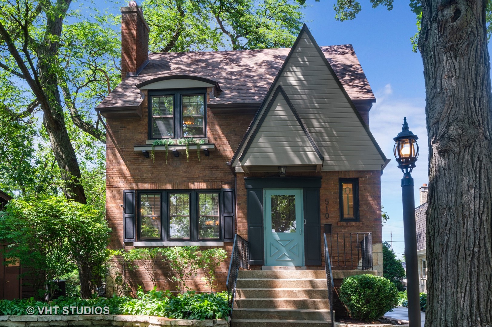 510 Berkeley Road Riverside, IL 60546 - Photo 1 of 30 a front view of a house with garden