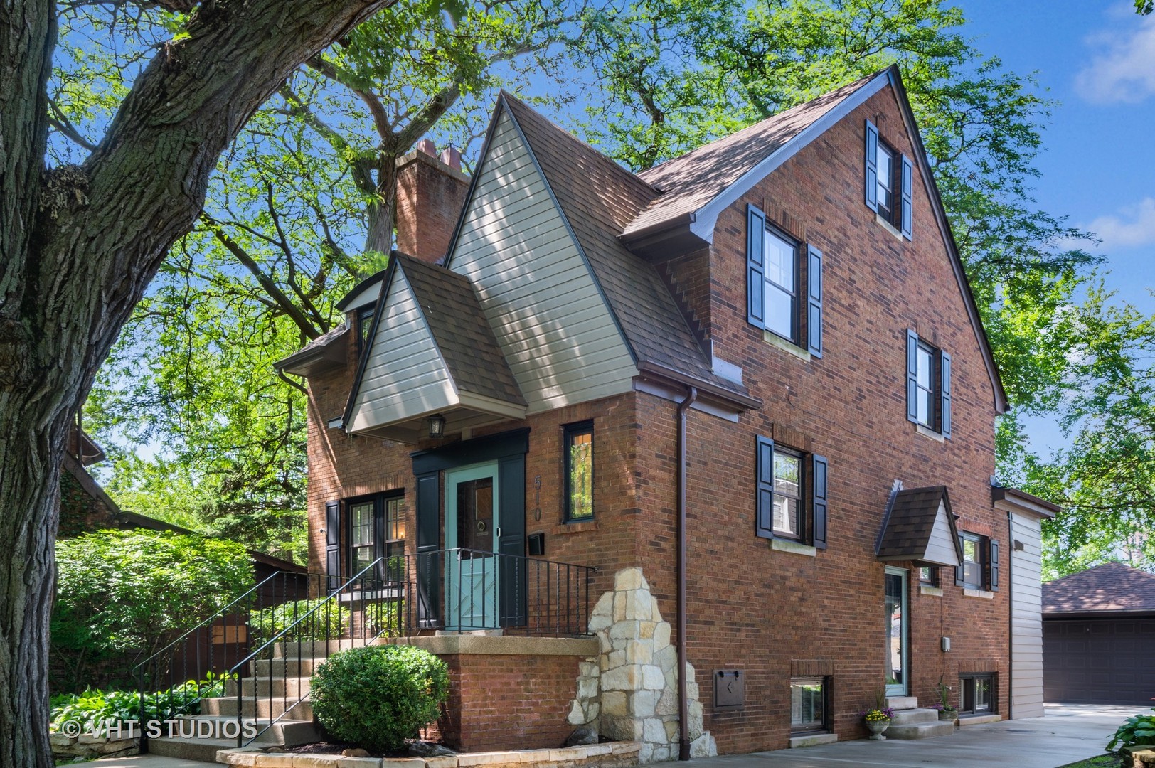 510 Berkeley Road Riverside, IL 60546 - Photo 2 of 30 a front view of a house with a garden