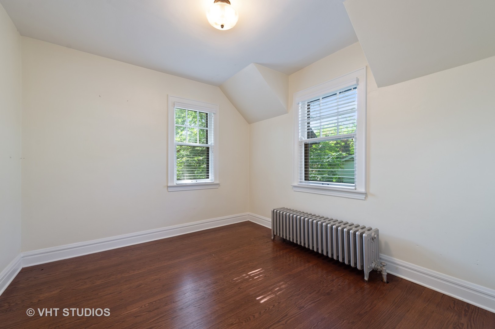 510 Berkeley Road Riverside, IL 60546 - Photo 17 of 30 an empty room with wooden floor and windows