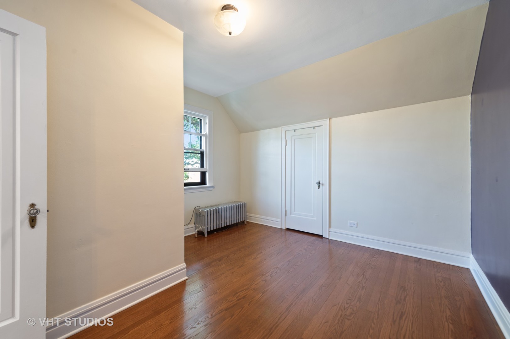 510 Berkeley Road Riverside, IL 60546 - Photo 18 of 30 an empty room with wooden floor and windows