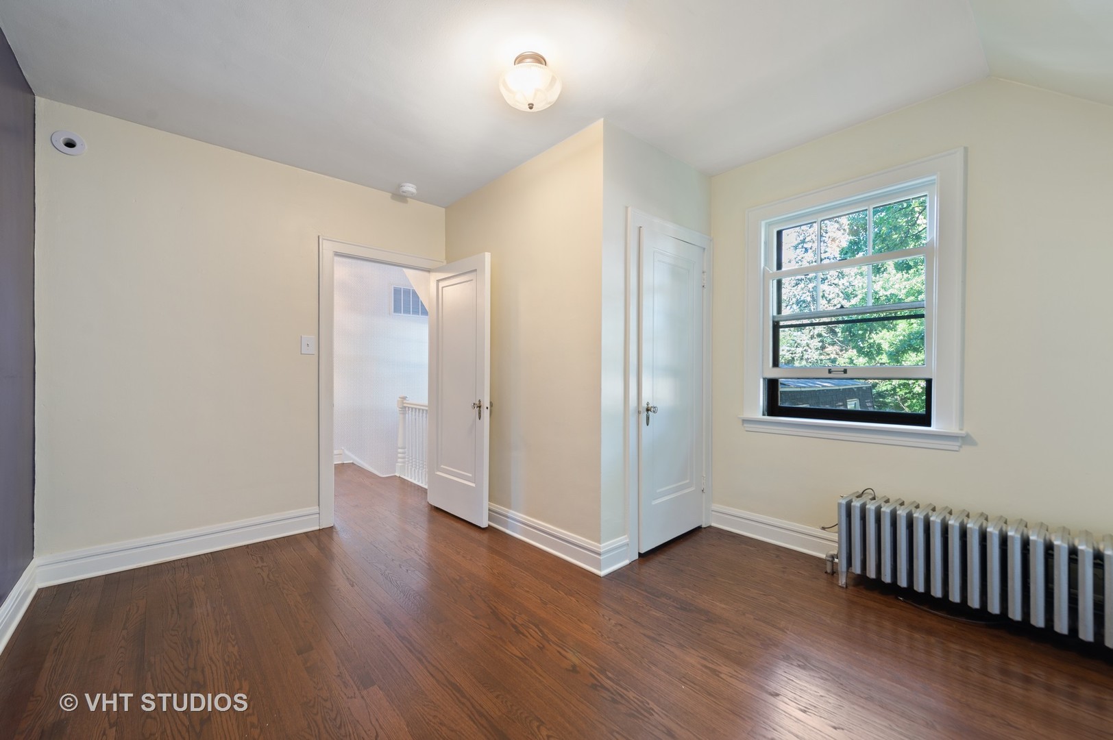 510 Berkeley Road Riverside, IL 60546 - Photo 19 of 30 an empty room with wooden floor and windows