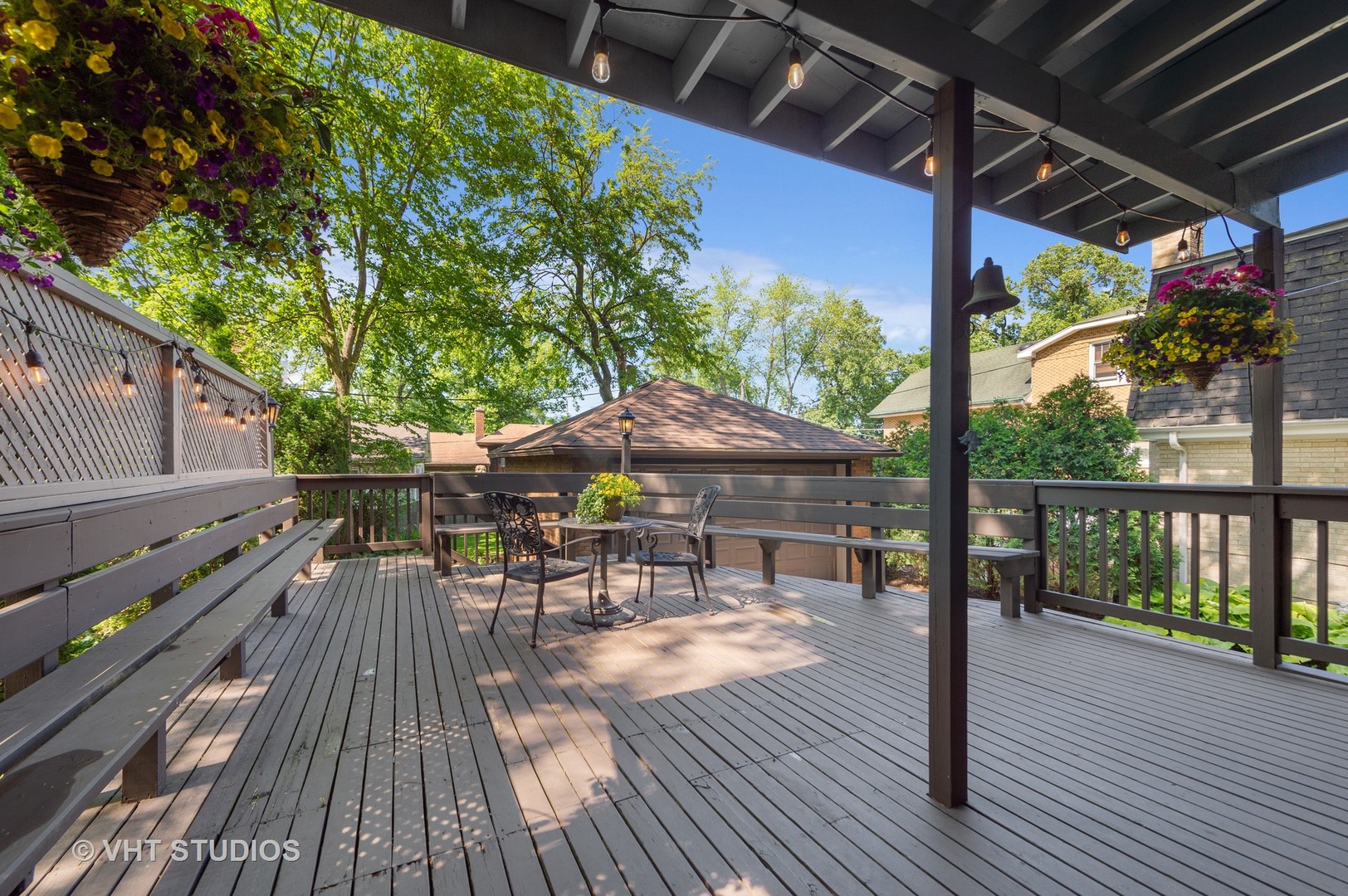 510 Berkeley Road Riverside, IL 60546 - Photo 26 of 30 a view of a patio with table and chairs under an umbrella with wooden floor